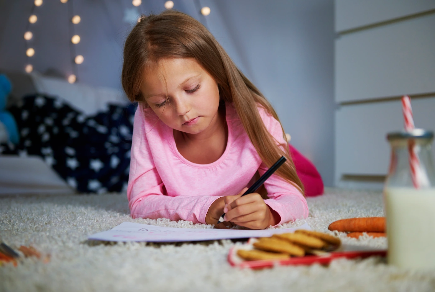Girl journaling while she is enjoying her cockies